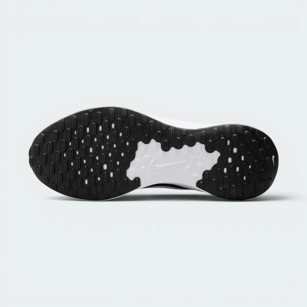 Displays the generative tread pattern of the durable black rubber sole, showcasing the raised rubber lugs engineered for unreal uphill and downhill street grip.