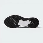 Displays the generative tread pattern of the durable black rubber sole, showcasing the raised rubber lugs engineered for unreal uphill and downhill street grip.