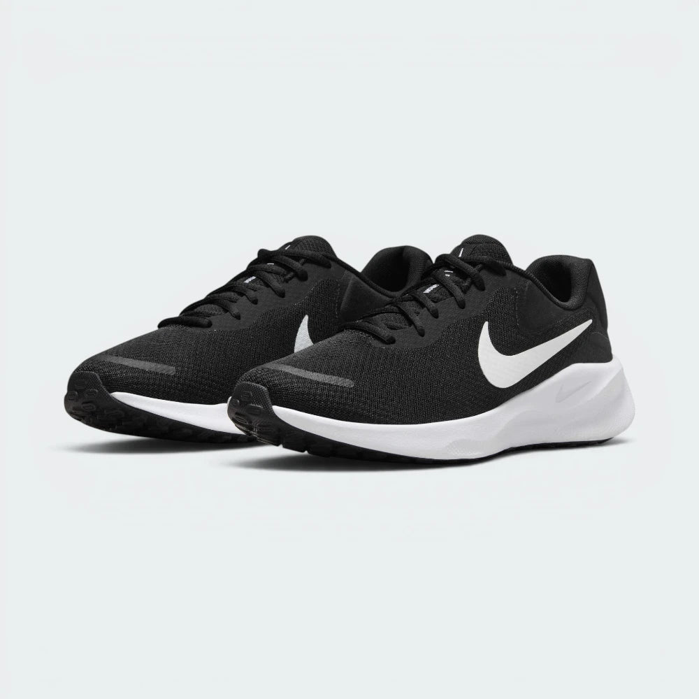 Emphasising the low-cut, forward-leaning athletic running stance and the clean harmony of the deep black uppers sitting cleanly above the white sole tooling.