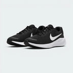Emphasising the low-cut, forward-leaning athletic running stance and the clean harmony of the deep black uppers sitting cleanly above the white sole tooling.