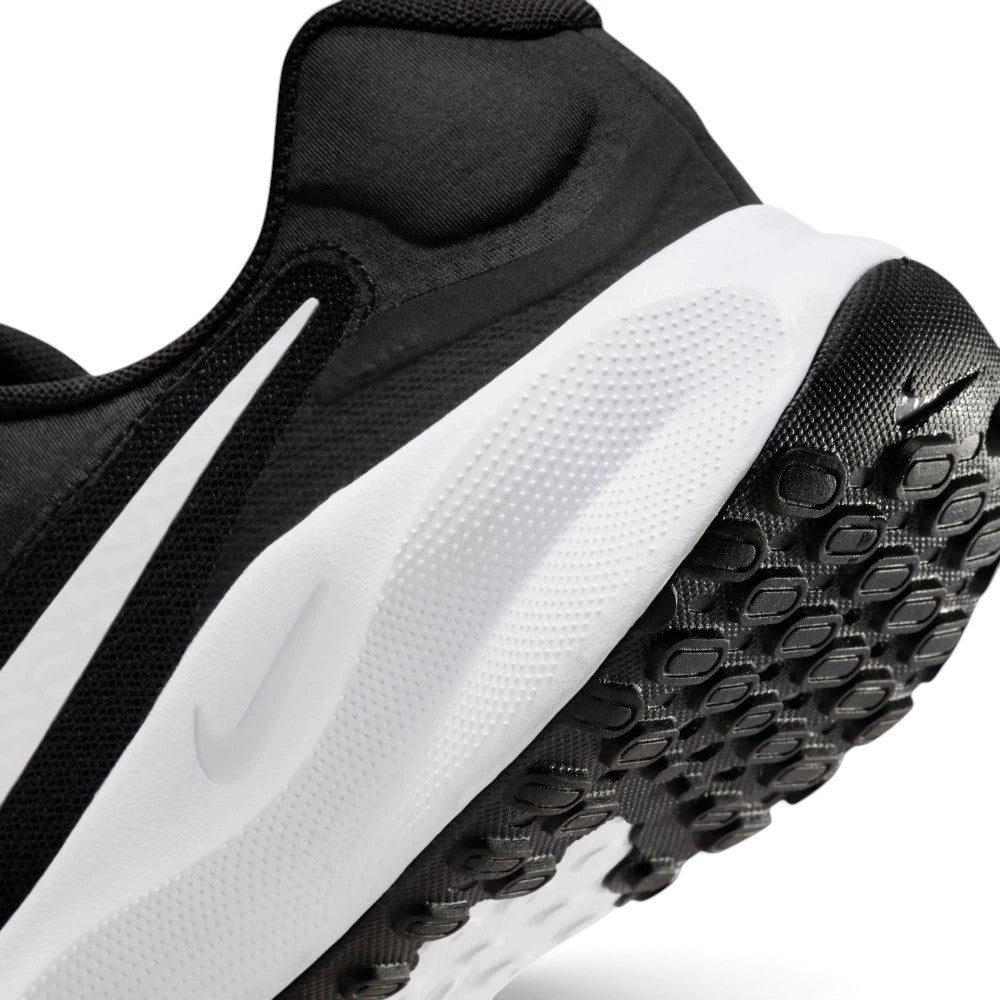 Highlights the "unreal" clean finish where the textured white foam midsole meets the generative lugged rubber outsole tread and subtle debossed mini Swoosh branding.