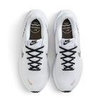 Top-Down View of Pair: Overhead view looking down at the laced white running shoes, displaying the black flat laces, branded tongue labels, and the comfort footbed detailing.   