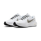 Angle View Showing Details Side by Side: Angled front-three-quarter perspective capturing the reinforced toe cap, mesh texture, animal-print side swoosh, and gold mini-swoosh branding.   