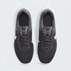 Top-down view of a pair of Nike Revolution 6 Next Nature Men's running trainers in grey, highlighting their streamlined silhouette and lace-up closure.