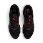 Overhead view of both running shoes showing the breathable black mesh forefeet, central lacing systems, and branded insoles featuring "COMFORT" footbed text.