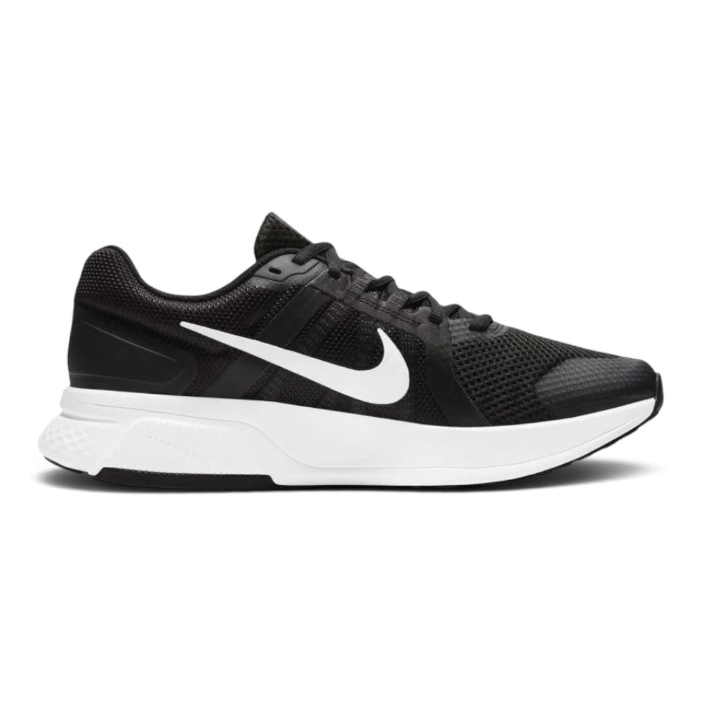 Highlights the athletic lateral profile showing the breathable Black mesh upper, contrasting White Nike Swoosh, Dark Smoke Grey overlay accents, sculpted thick white foam midsole, and black rubber outsole tread.