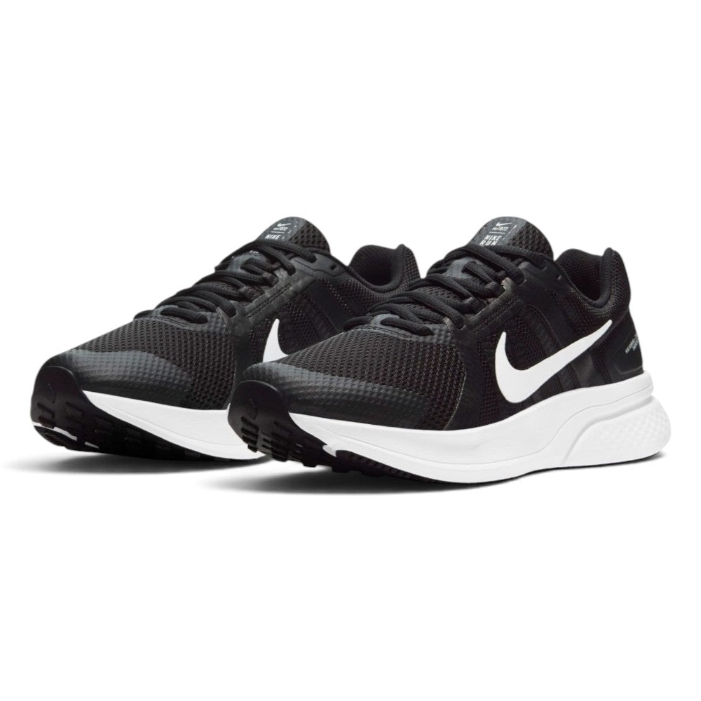 Emphasising the low-slung, streamlined stance of the runners and the clean contrast between the dark upper mesh, dynamic side webbing, and thick white cushioning foam.