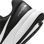 Highlights the "unreal" clean finish where the high-stack white foam midsole meets the durable black rubber outsole and the trailing tail of the white Swoosh.
