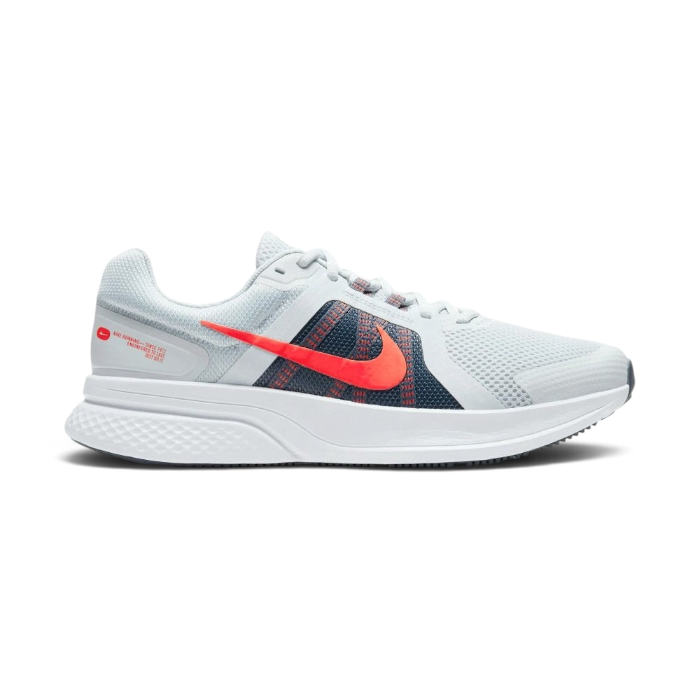 Highlights the high-velocity sweep of the contrasting Chile Red Nike Swoosh, showing the professional, multi-textured grey mesh upper, the Obsidian navy midfoot paneling, and the clean white foam midsole wall.