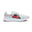 Highlights the high-velocity sweep of the contrasting Chile Red Nike Swoosh, showing the professional, multi-textured grey mesh upper, the Obsidian navy midfoot paneling, and the clean white foam midsole wall.