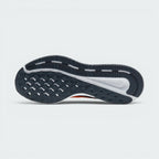 Displays the classic waffle-inspired grid pattern of the dark rubber sole, showcasing the deep flex grooves engineered for unreal everyday walking flexibility and grip.