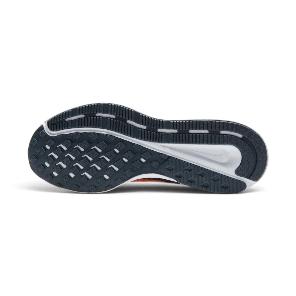 Displays the classic waffle-inspired grid pattern of the dark rubber sole, showcasing the deep flex grooves engineered for unreal everyday walking flexibility and grip.