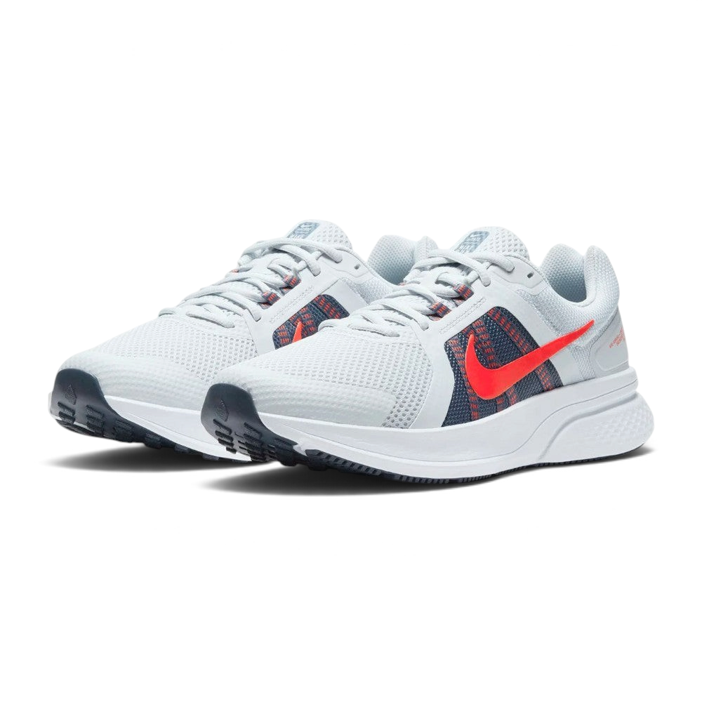Emphasising the low-slung, forward-leaning running stance and the professional harmony of the red, grey, and navy contrast panels.