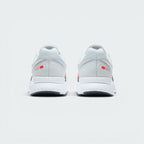 Focuses on the contoured shape of the padded low-cut collar, highlighting the seamless grey heel structure and the printed red Nike Running logo badge sitting squarely above the midsole.