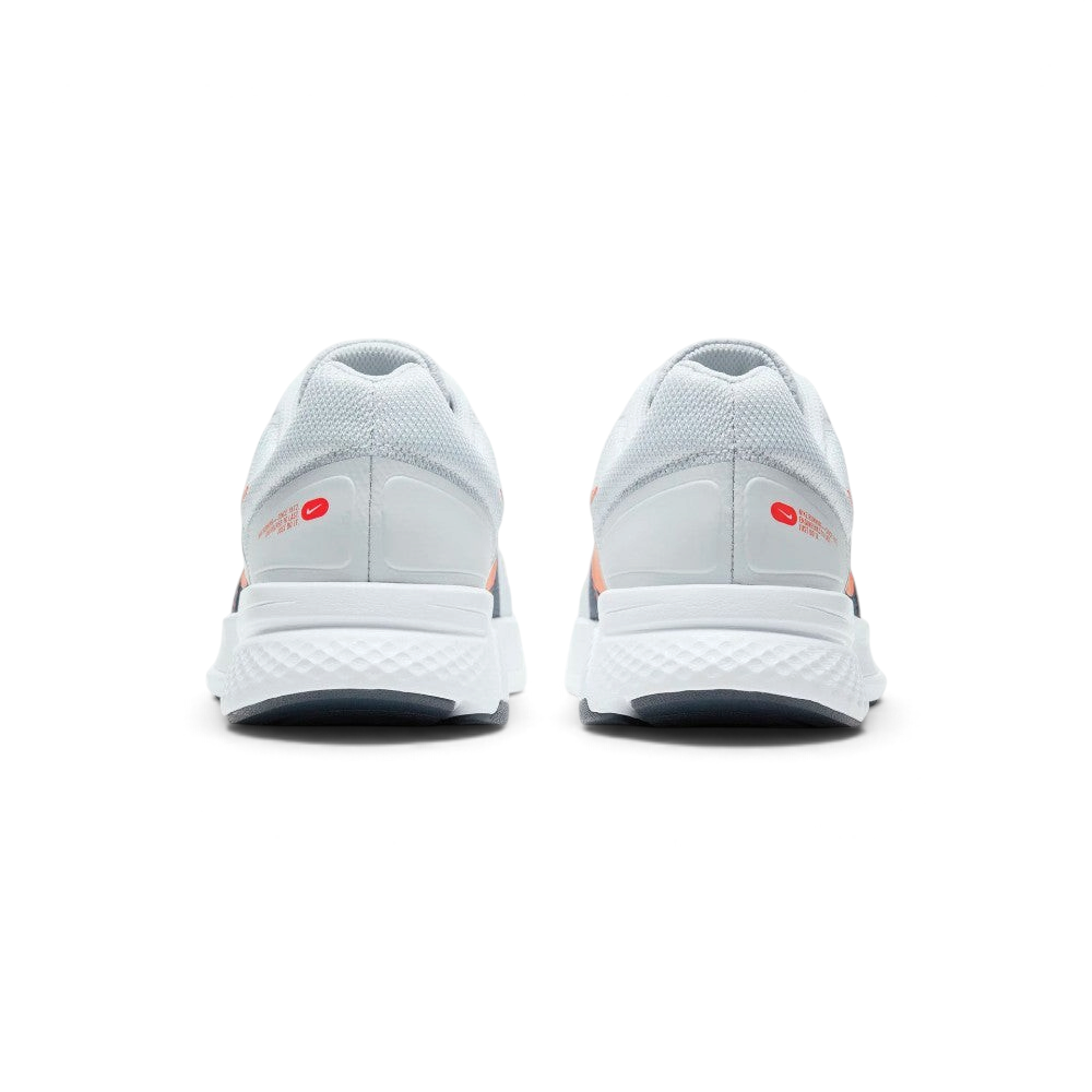 Focuses on the contoured shape of the padded low-cut collar, highlighting the seamless grey heel structure and the printed red Nike Running logo badge sitting squarely above the midsole.