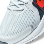 Details the premium precision of the seamless overlays wrapping the front toe cap to defend against debris, showing off the breathable perforations in the mesh up close.