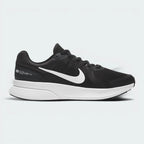 Highlights the high-velocity white Nike Swoosh slashing across the professional depth of the black mesh upper and the contoured dark smoke grey midsole wall.