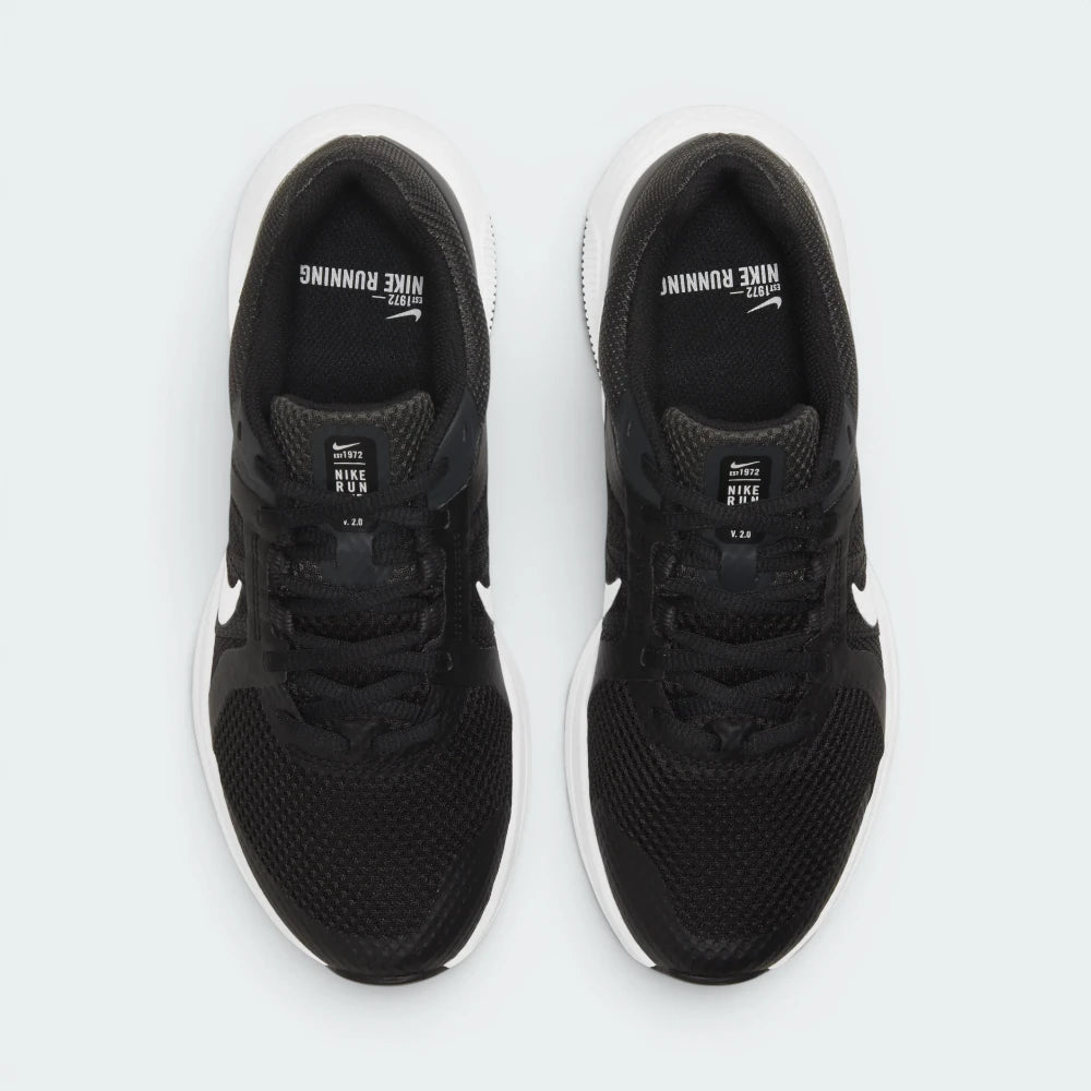 Focuses on the locked-in webbed lace configuration, the structural alignment of the Flywire channels, and the breathable texture of the toe box.