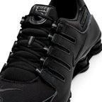 Macro focus on the technical ghillie lacing loops, textured mesh toe box, and the synthetic mudguard overlay.