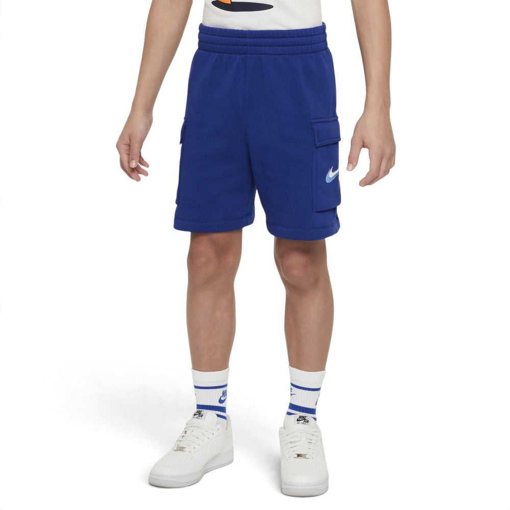 Displays the full lateral silhouette featuring the vibrant Deep Royal Blue French terry body, stitched side cargo pocket with flap closure, clean side seam, and embroidered white Nike Futura logo.