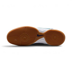 Displays the multi-studded rubber traction pattern of the durable astro turf sole, showcasing the multi-directional stud layout engineered for unreal grip and quick pivots on artificial grass.