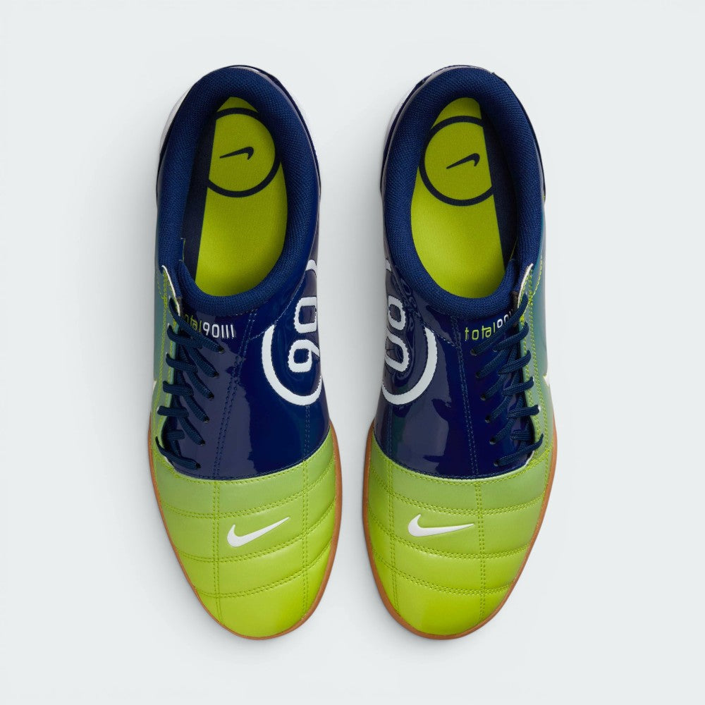 Focuses on the locked-in off-centre lacing layout, displaying the perfect symmetry of the asymmetrical tongue, blue laces, and the enlarged strike zone across the front toe box area.