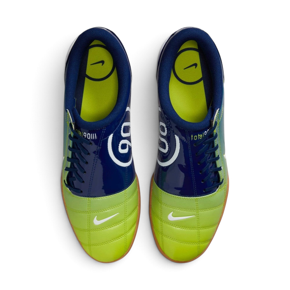 Focuses on the locked-in off-centre lacing layout, displaying the perfect symmetry of the asymmetrical tongue, blue laces, and the enlarged strike zone across the front toe box area.