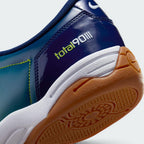 Highlights the "unreal" clean finish where the low-profile cushioning midsole meets the high-density turf rubber studs below.