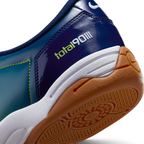 Highlights the "unreal" clean finish where the low-profile cushioning midsole meets the high-density turf rubber studs below.