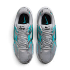  Overhead view of both running shoes showing the breathable grey mesh forefeet, central lacing systems, and branded insoles featuring teal Nike Swooshes.