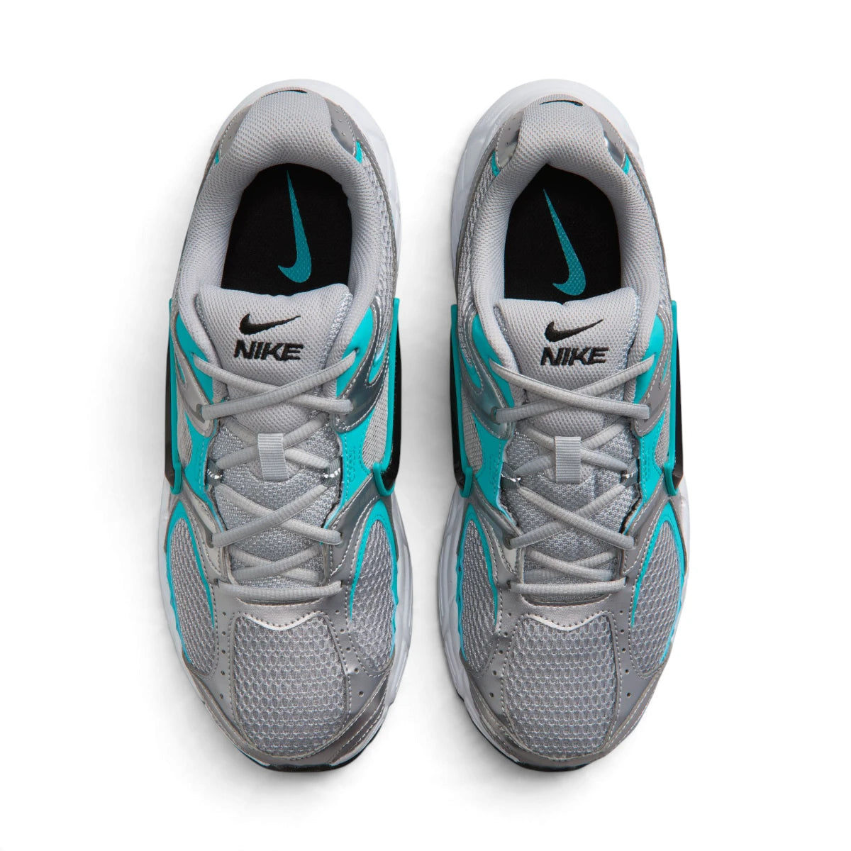  Overhead view of both running shoes showing the breathable grey mesh forefeet, central lacing systems, and branded insoles featuring teal Nike Swooshes.