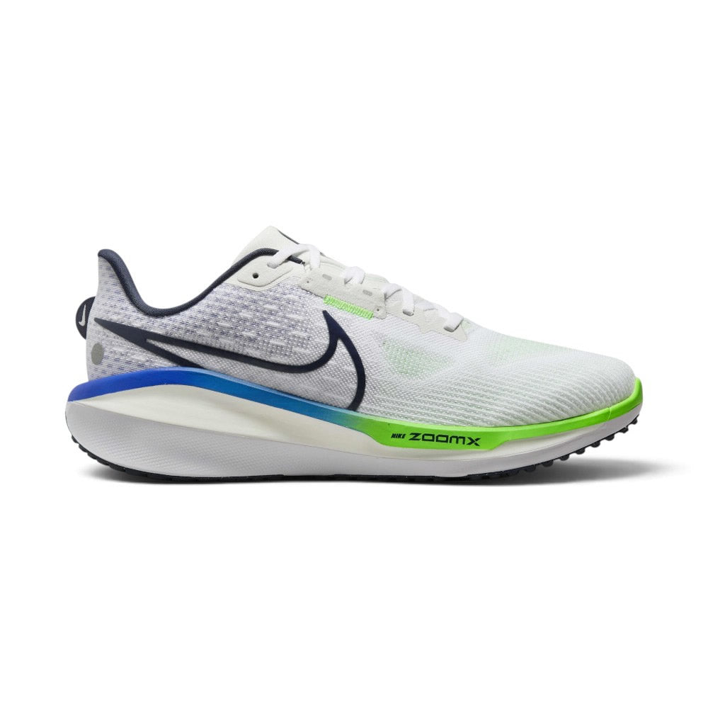 Capturing the maximum-cushion road running silhouette, detailing the white engineered mesh upper, racer blue and thunder blue layered lateral Swooshes, sculpted dual-density stacked white ZoomX and Cushlon 3.0 midsole, and black rubber outsole edge.