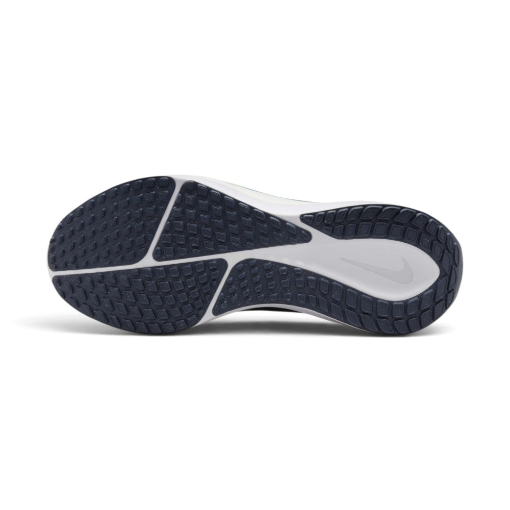 Focusing on the durable full-length black rubber outsole featuring redesigned waffle lugs with longitudinal break points and forefoot flex channels, showcasing the road grip matrix engineered for a successful tackle of wet tarmac, asphalt, and concrete pavements.