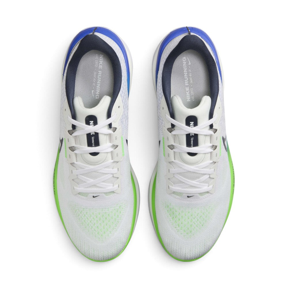 Highlighting the symmetrical central lacing throat, flat white laces, plush padded tongue with Nike Vomero 17 branding, padded collar lining, and cushioned blue sockliner, demonstrating the upper template constructed for a comfortable "locked-in" fit.