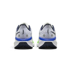 Showing the structured rear profile, detailing the plush padded thunder blue collar, moulded internal heel counter, subtle reflective accents, and wide bevelled foam crash pad.