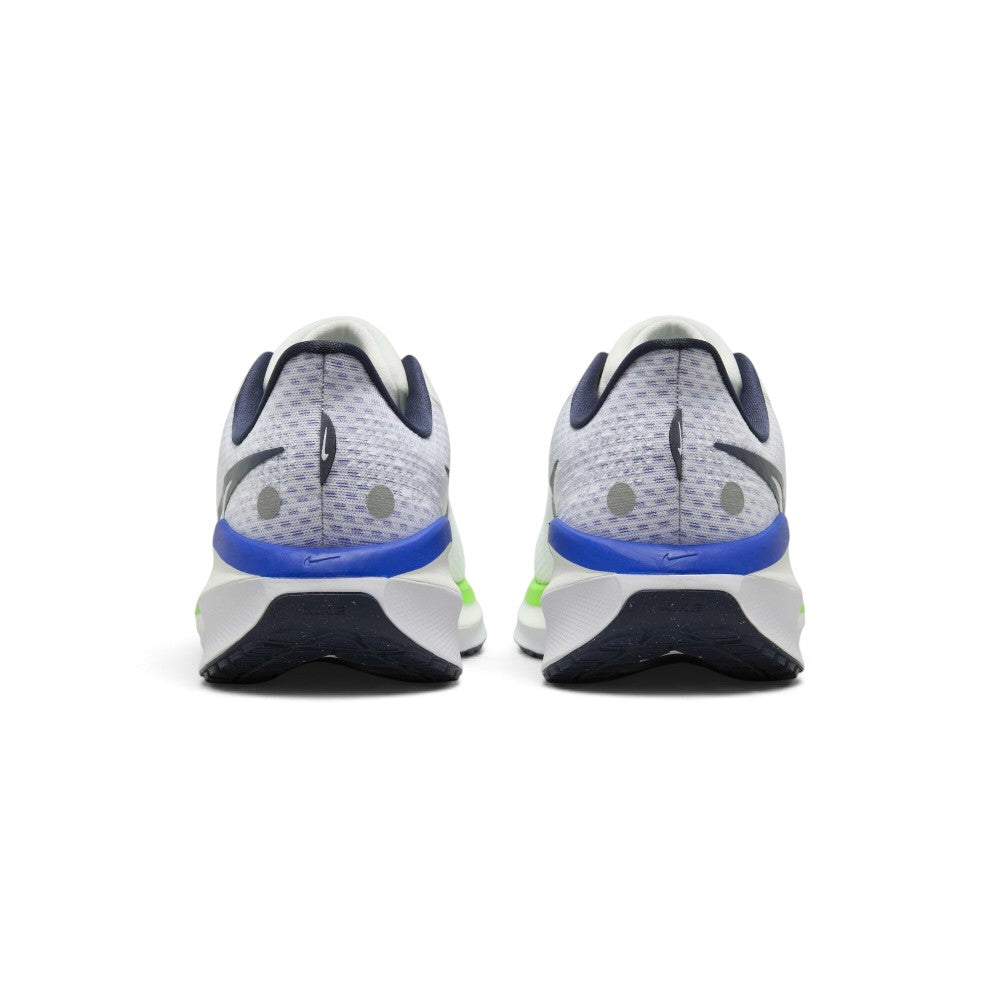 Showing the structured rear profile, detailing the plush padded thunder blue collar, moulded internal heel counter, subtle reflective accents, and wide bevelled foam crash pad.