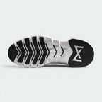 Outsole View: Showing the hybrid traction pattern with Nike Free sipes in the front and a flat, stable lifting base at the rear.