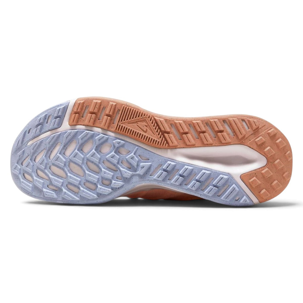 Bottom-down view of the multi-colored rubber outsole, showcasing the rugged directional lug pattern, durable heel brake zones, and Nike Trail branding.