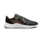 Side Profile Image: The Dark Smoke Grey Downshifter 12, highlighting the gleaming Metallic Silver Swoosh and the elevated dark foam midsole.