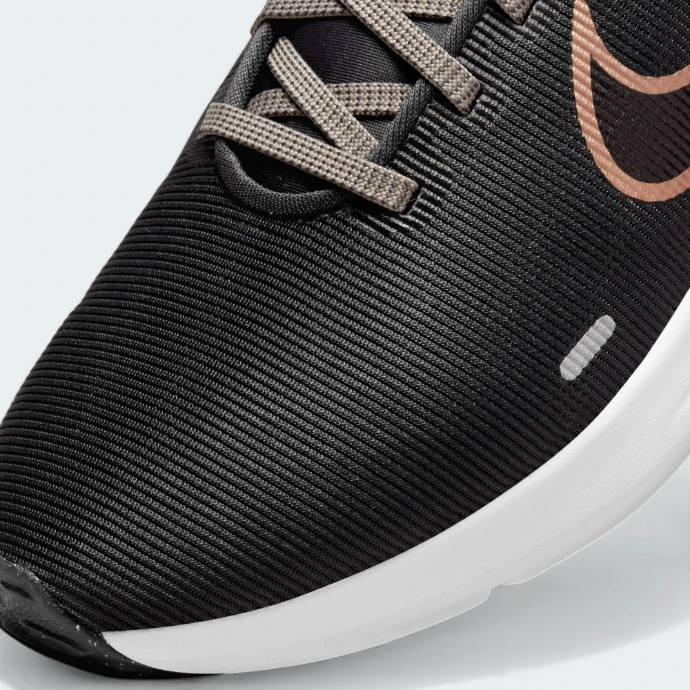 Zoom Looking at the Front of the Shoes and Laces: A close-up of the technical mesh grain and the reinforced dark eyelet skins.