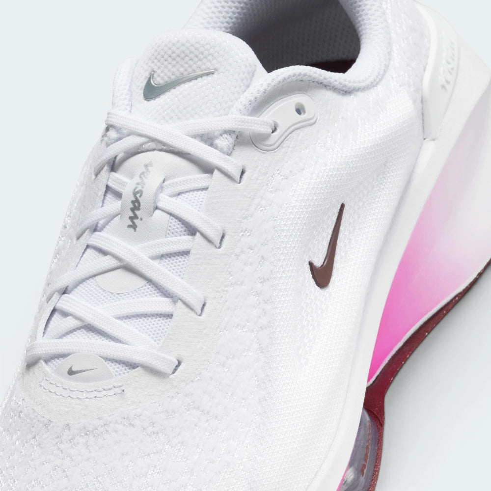 Details the high-definition breathability of the toe box mesh and the precision of the silver branding.
