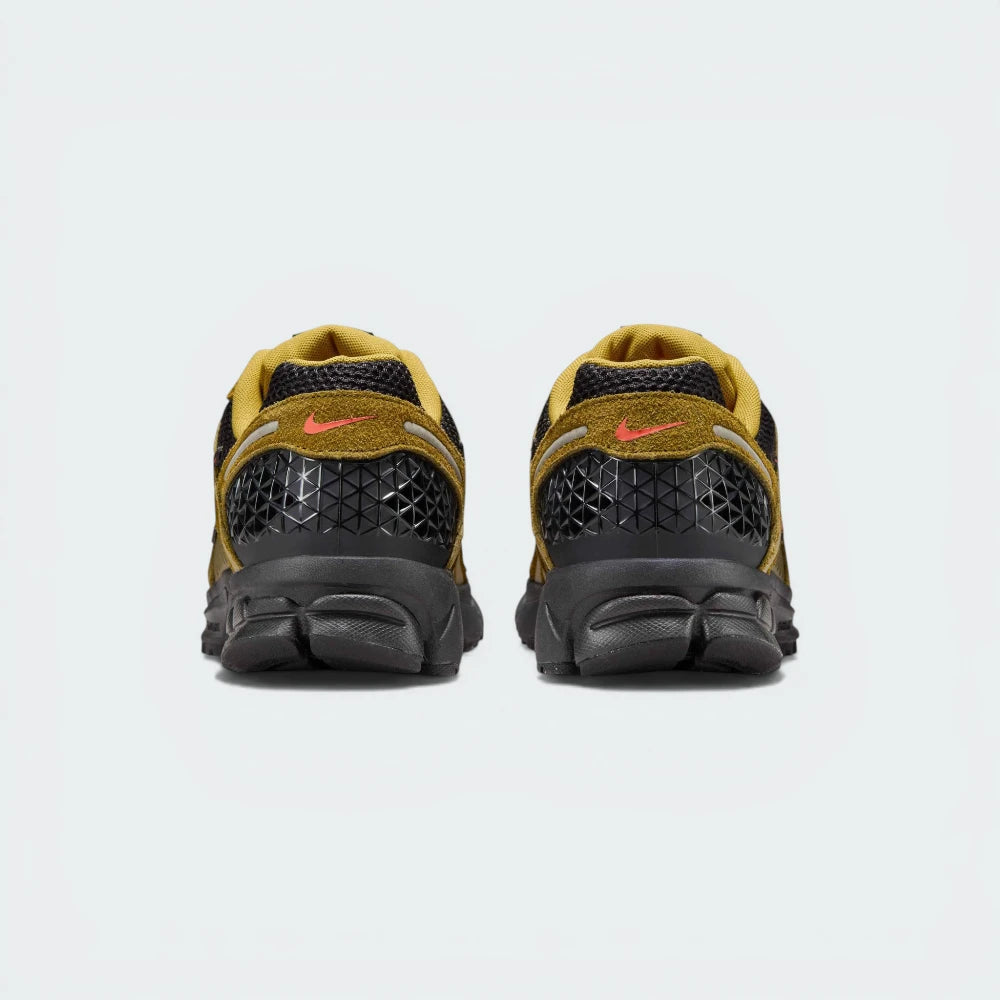 View from Behind Looking at the Heel: Focusing on the ventilated plastic cage and the layered midsole construction.