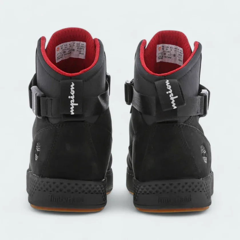 Rear view of the Timberland X Champion City Roam black boots, focusing on the structured heel and subtle collaborative branding.