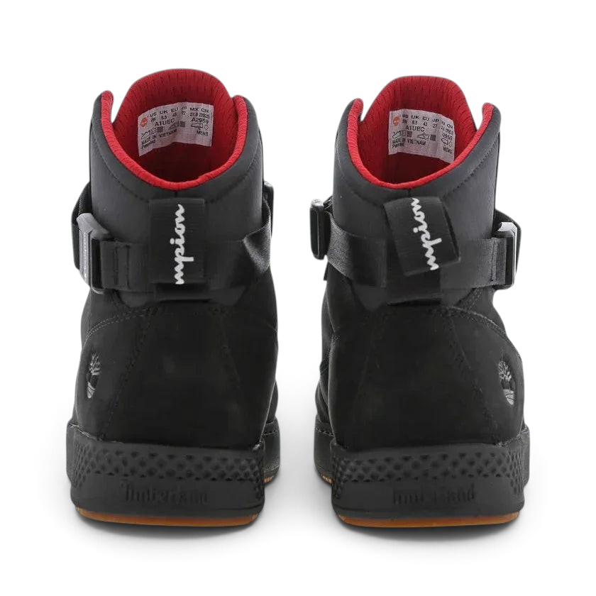 Rear view of the Timberland X Champion City Roam black boots, focusing on the structured heel and subtle collaborative branding.