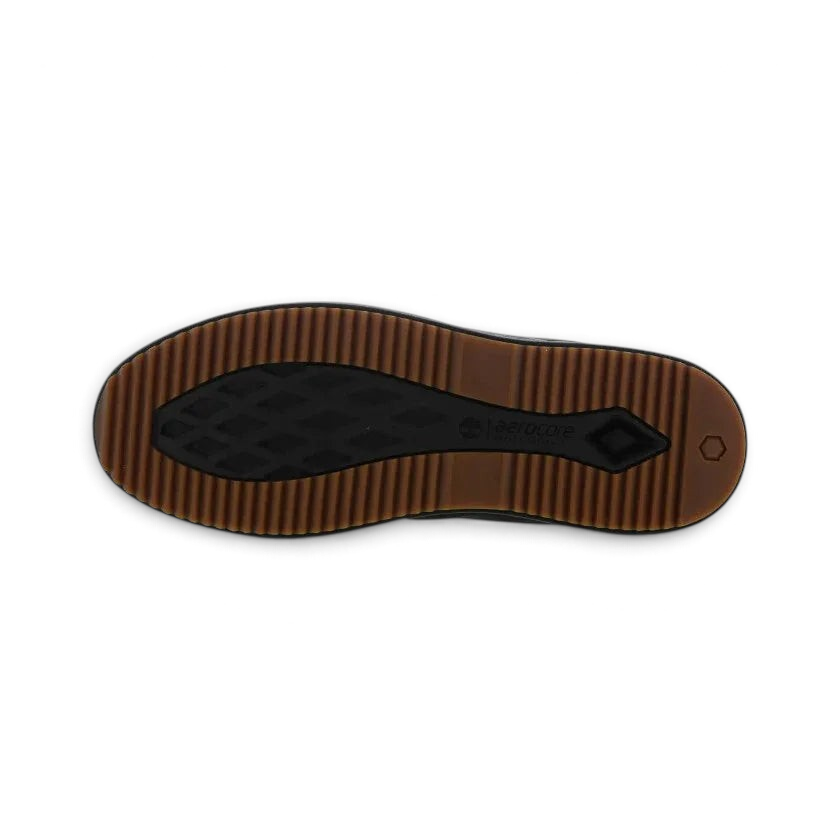 View of the outsole of the Timberland X Champion City Roam black boots, showing the durable rubber outsole with a unique lug pattern for traction.