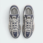 Focuses on the locked-in traditional lacing layout, displaying the perfect symmetry of the navy mesh tongue, the vertical structural lace bands, and the breathable mesh paneling guarding the front toe box area.