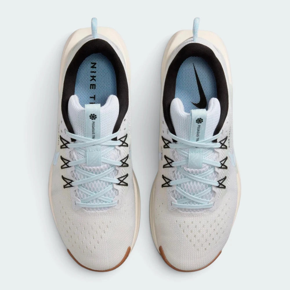 Focuses on the locked-in lacing layout, displaying the white mesh tongues, flecked laces, Glacier Blue Flywire eyelet cables, and custom topographic trail map printed insoles.