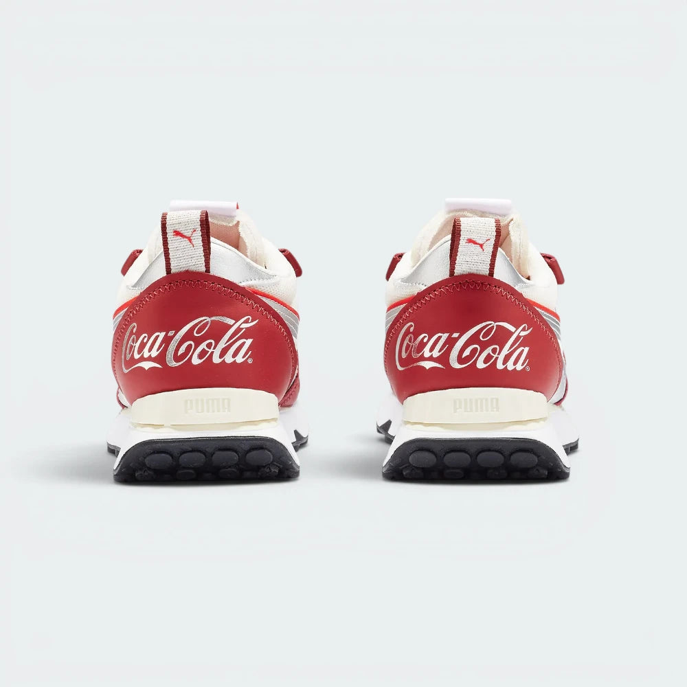 Focuses on the Coca-Cola branding and the professional finish of the multi-layered heel structure.