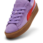 Details the high-definition suede grain and the precision of the gold-tone lace tips.