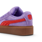 Focuses on the debossed FENTY branding and the professional finish of the stacked heel.